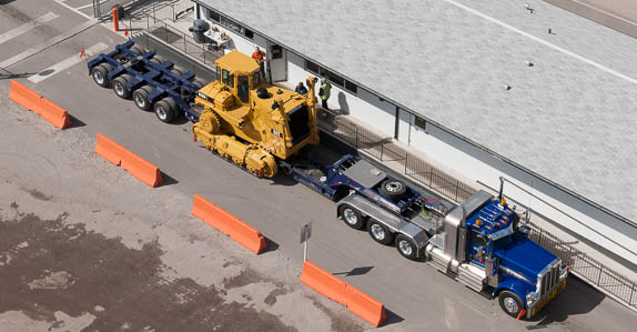 Equipment being transported from a Ritchie Bros. auction Equipment being transported from a Ritchie Bros. auction