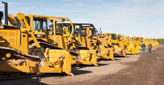 Line up of CAT crawler tractors being sold at a Ritchie Bros. unreserved auction